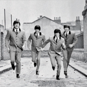 Cleveland's Hard Day's Night recreating the iconic running scene from the Beatles' film of the same name in grey suits.
