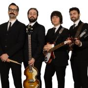 The Wonders from Bari in Italy. A Beatles tribute band in black suits.