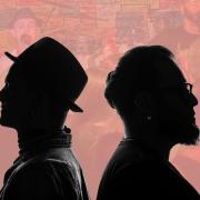 Sonido Club in silhouette in front of an image of them on the cavern club stage